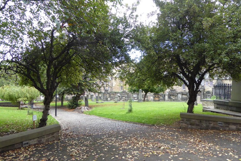 A pretty view of trees, grass and gravestones in Greyfriars Kirkyard